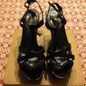 Black 4-4 1/2 inch Paten Leather BCBG heels.
